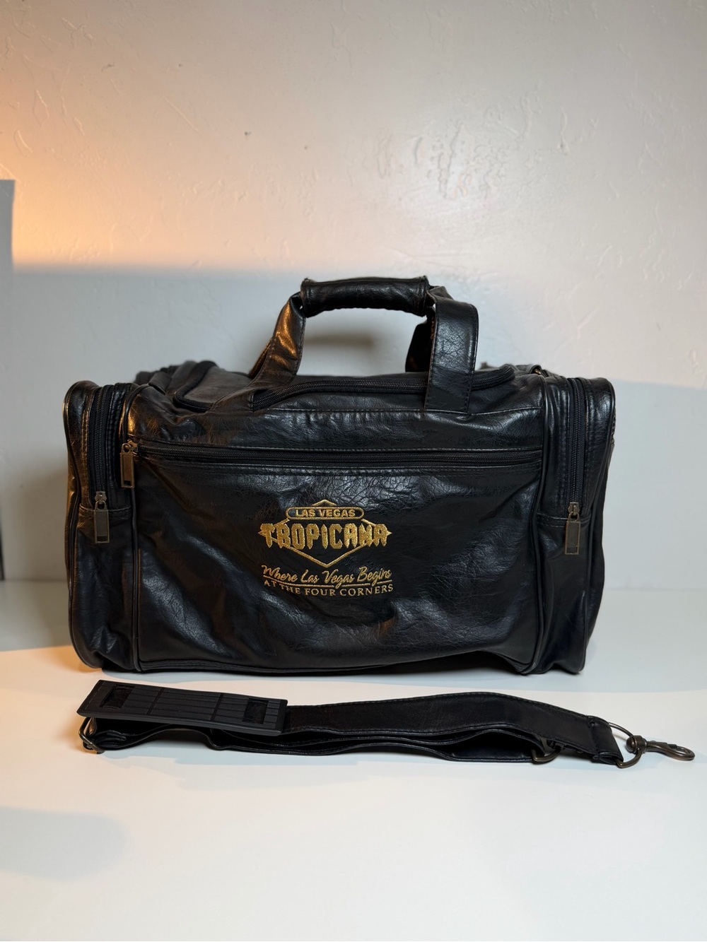 Vintage Las Vegas Tropicana Leather Duffel Black and Gold Bag shoulder strap